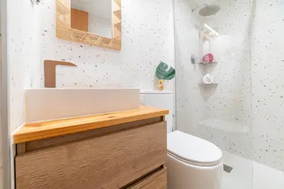 a bathroom with a sink and a toilet at Terrassa de Mar Apartment in Masnou