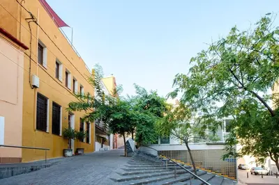 an empty street with stairs next to a building at Terrassa de Mar Apartment in Masnou