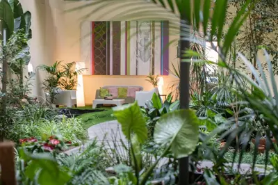 a room filled with lots of plants at Aura Park Aparthotel Fira Barcelona in Hospitalet de Llobregat
