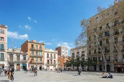 a group of people walking around a city square at Modern and Trendy Duplex next to Paseo de Gracia in Barcelona