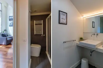 a bathroom with a toilet and a sink at Modern and Trendy Duplex next to Paseo de Gracia in Barcelona