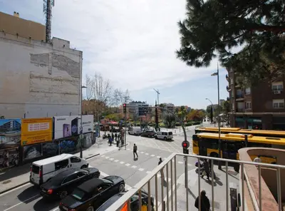 a busy city street with cars and a bus at La casa del Pi · La casa del Pi · House in the city, next to Barcelona and beach in Badalona