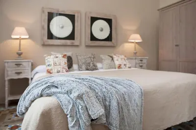a bedroom with a large bed and two night stands at BCN Rambla Catalunya Apartments in Barcelona