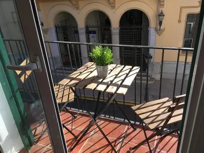 a potted plant sitting on a table on a balcony at Sitges Apartment in Sitges