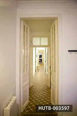 a hallway in a house with a door open at Big Apartment Barcelona Gran via in Barcelona