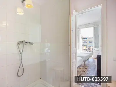 a bathroom with a shower with a glass door at Big Apartment Barcelona Gran via in Barcelona