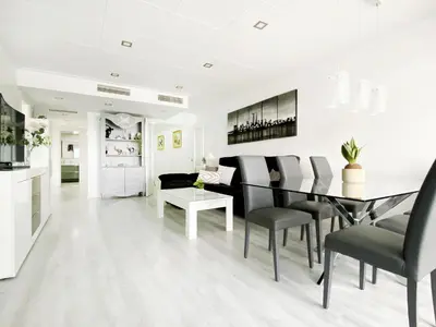 a kitchen and dining room with a table and chairs at fantasticas vistas a mar in Pineda de Mar