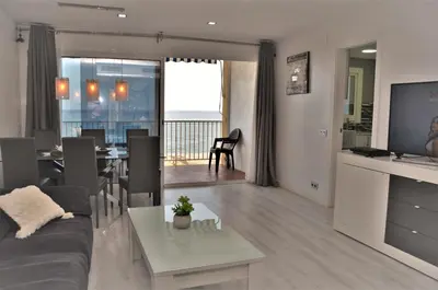 a living room with a couch and a table at fantasticas vistas a mar in Pineda de Mar