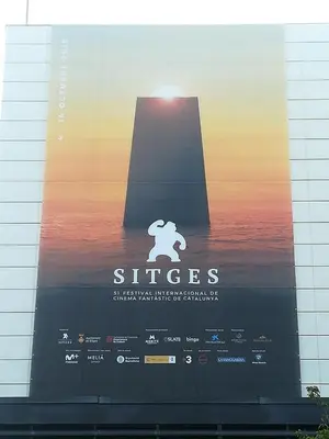 a poster for a movie on the side of a building at Heart of Sitges in Sitges