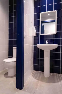a bathroom with a toilet and a sink and a mirror at Sea Hostel Barcelona in Barcelona