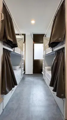 a walk in closet with racks of shoes at Sea Hostel Barcelona in Barcelona