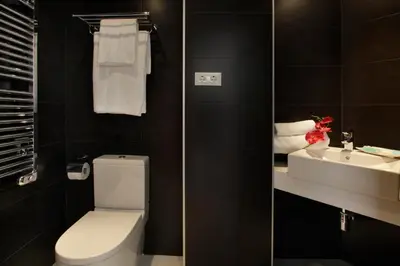 a bathroom with a toilet and a sink at Fisa Rentals Les Corts Apartments in Barcelona