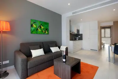 a living room with a couch and a table at Fisa Rentals Les Corts Apartments in Barcelona
