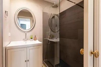a bathroom with a sink and a mirror at Central Suites Barcelona in Barcelona