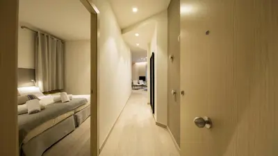 a hotel room with a bed and a mirror at Fisa Rentals Ramblas Apartments in Barcelona