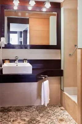 a bathroom with a sink and a mirror at Wello Apartments in Barcelona