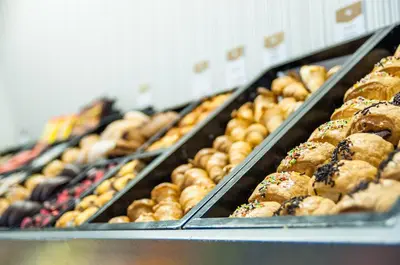a bunch of pastries on display in a bakery at Ikonik Ramblas in Barcelona