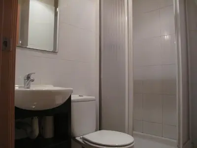 a bathroom with a toilet and a sink and a shower at Hostal LK Barcelona in Barcelona