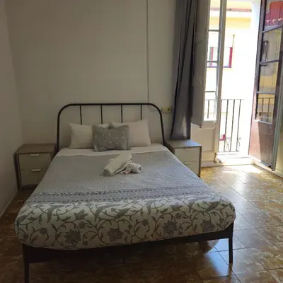 a bed with a stuffed animal laying on it at YOUTH HOSTEL - Central and Basic Drassanes in Barcelona