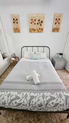 a bedroom with a bed with two towels on it at YOUTH HOSTEL - Central and Basic Drassanes in Barcelona