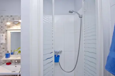 a bathroom with a shower and a sink at Barcelona City Rooms Hostal in Barcelona