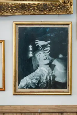 a framed picture of a woman on a wall at Pars Teatro Hostel in Barcelona