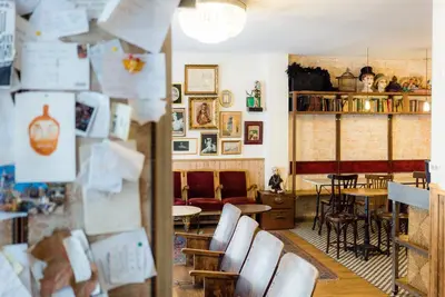 a room with chairs and a table and a dining room at Pars Teatro Hostel in Barcelona
