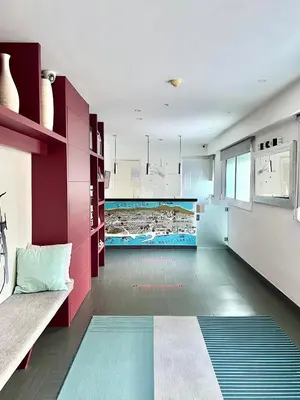 a living room with purple cabinets and a couch at Hostal Apolo in Barcelona