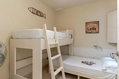 a room with two bunk beds with a ladder at AB Poble Nou Venero in Barcelona