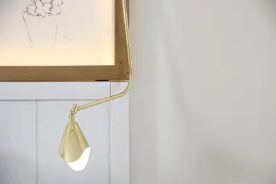 a light on a wall with a white wall at Ofelias Hotel 4Sup in Barcelona