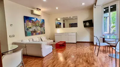 a living room with a couch and a table at Hostal Madrazo in Barcelona