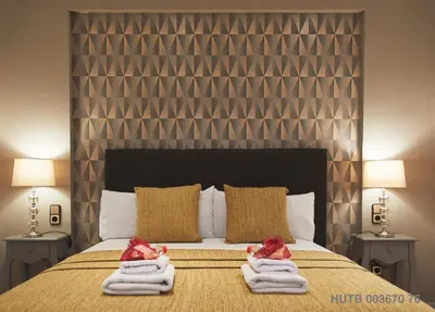 a bedroom with a bed with towels on it at Alcam Alio 1 in Barcelona