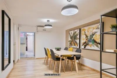a dining room with a table and chairs at Alcam Office up in Barcelona