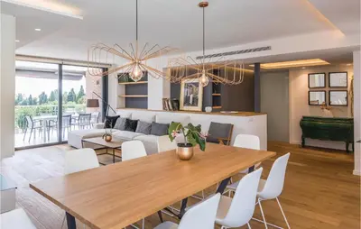 a dining room and living room with a table and chairs at Stunning Home In Alella With Wifi in Alella