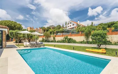 a swimming pool in the backyard of a house at Stunning Home In Alella With Wifi in Alella
