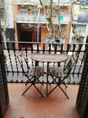 a bench on a balcony with a fence at Barcelona Rooms 294 in Barcelona