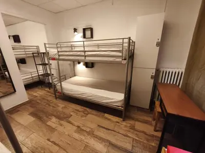 two bunk beds in a room with a wooden floor at Buba House - Women Only Hostel in Barcelona