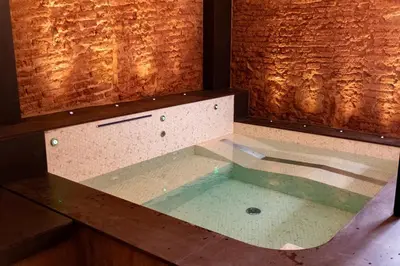 a glass box with a pool of water on a counter at Sa Voga Hotel & Spa in Arenys de Mar