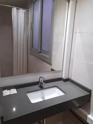 a bathroom with a sink and a mirror at Pensión San Ramón in Barcelona