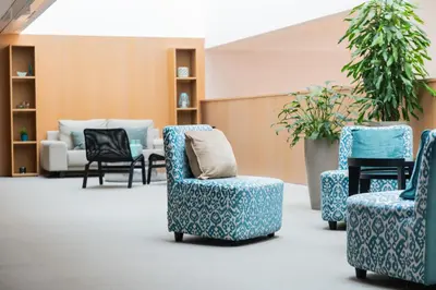 a waiting room with two chairs and a couch at Atenea Port Barcelona Mataró in Mataró