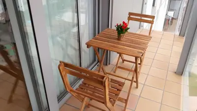 a small table and two chairs on a balcony at Duplex in Santa María de Barbará