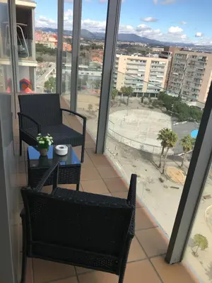 a balcony with chairs and a table with a view at Duplex in Santa María de Barbará