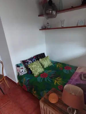 a couch with colorful pillows in a room at Penthouse Pza España - 4th Floor in Barcelona