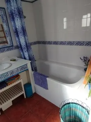 a bathroom with a tub and a sink at Penthouse Pza España - 4th Floor in Barcelona