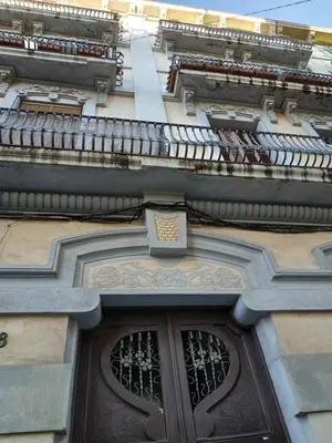 a building with a door and a window at Penthouse Pza España - 4th Floor in Barcelona