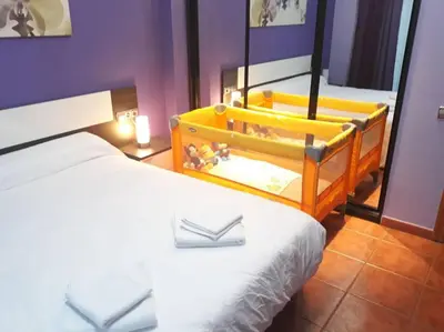 a hotel room with a bed and a mirror at PISO EXTERIOR COMPLETO A 20 ' DE BARCELONA. in Sabadell
