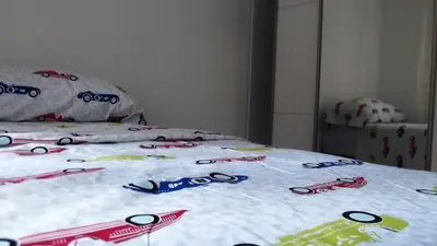 a bed with a group of scissors on it at Apartamentos Atlas Terrassa III in Terrassa