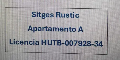 a sign with the names of different languages at Sitges Rustic Apartments in Sitges