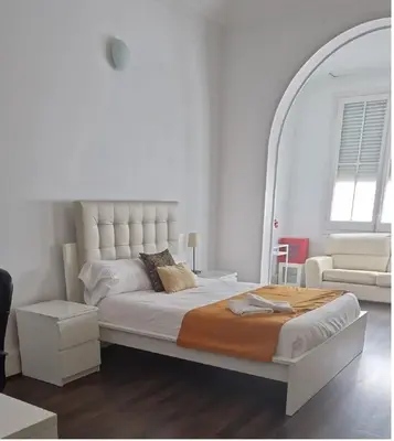 a bedroom with a large bed with a large mirror at BruStar Gotic-Centric in Barcelona
