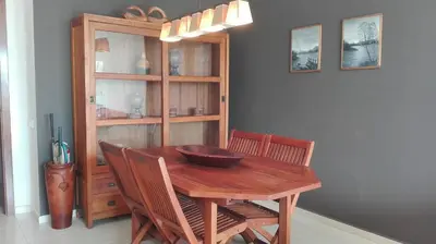 a dining room table with chairs and a bowl on it at Playa y Sol in Cubelles